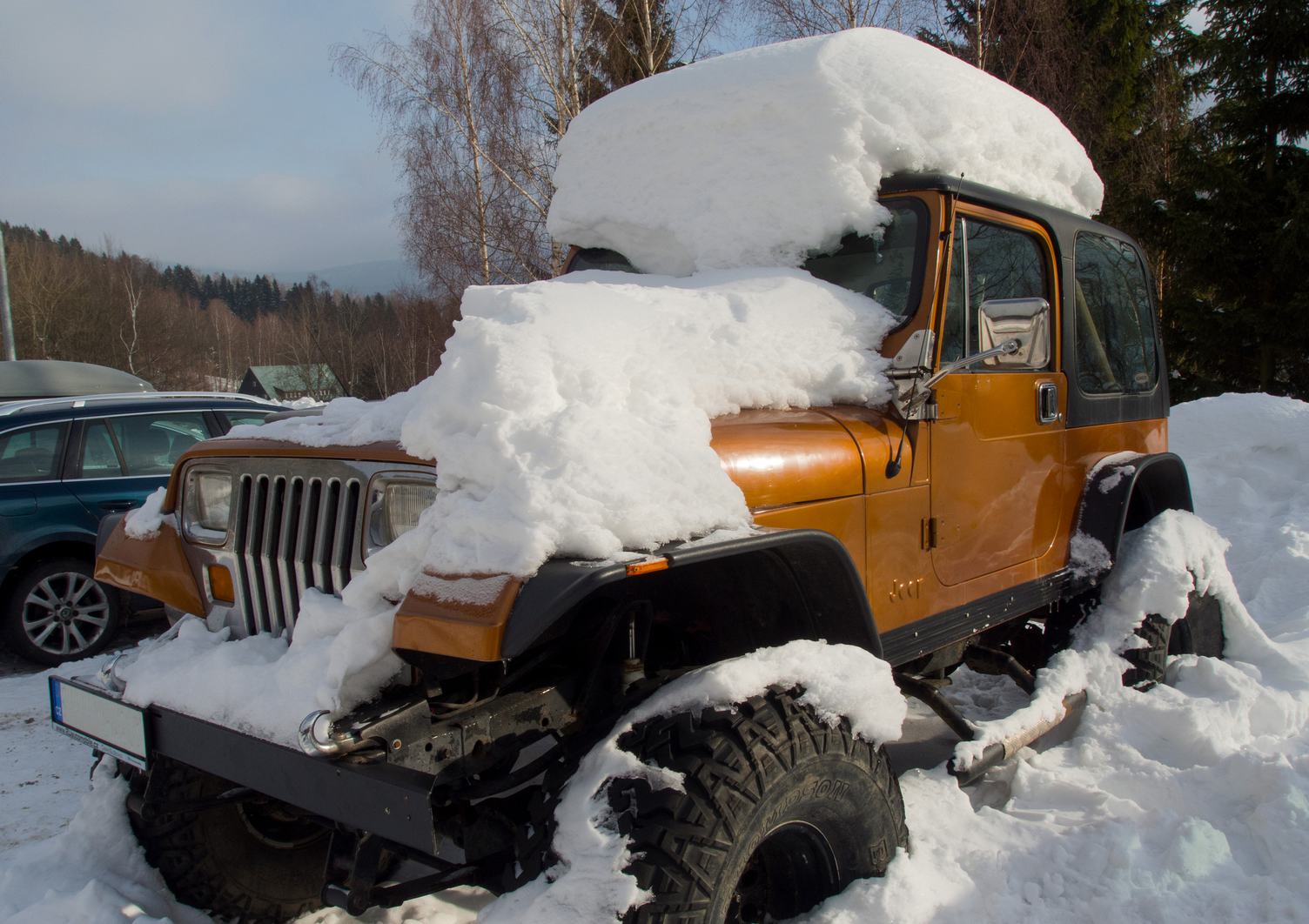 Jeep Covered with Snow