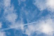 Plane Flying against Cloudy Sky