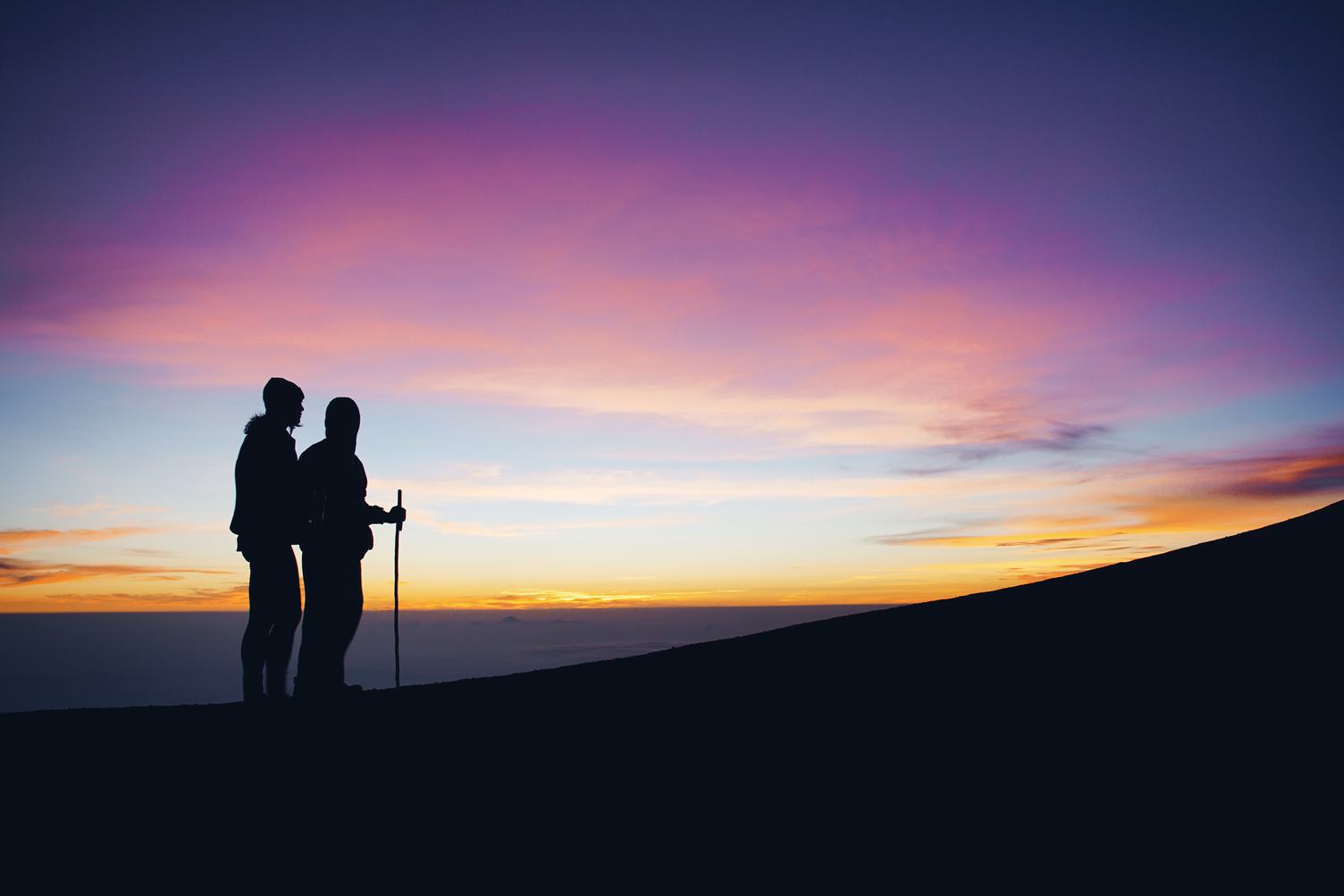 Couple Enjoying Sunset in the Mountains