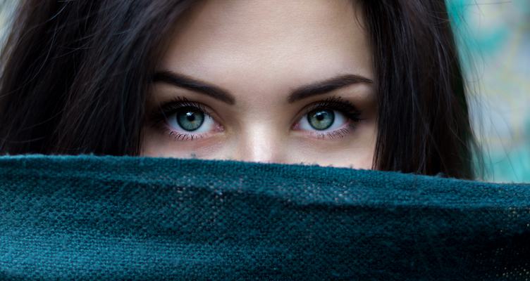 Portrait of Young Brunette Woman with Green Eyes
