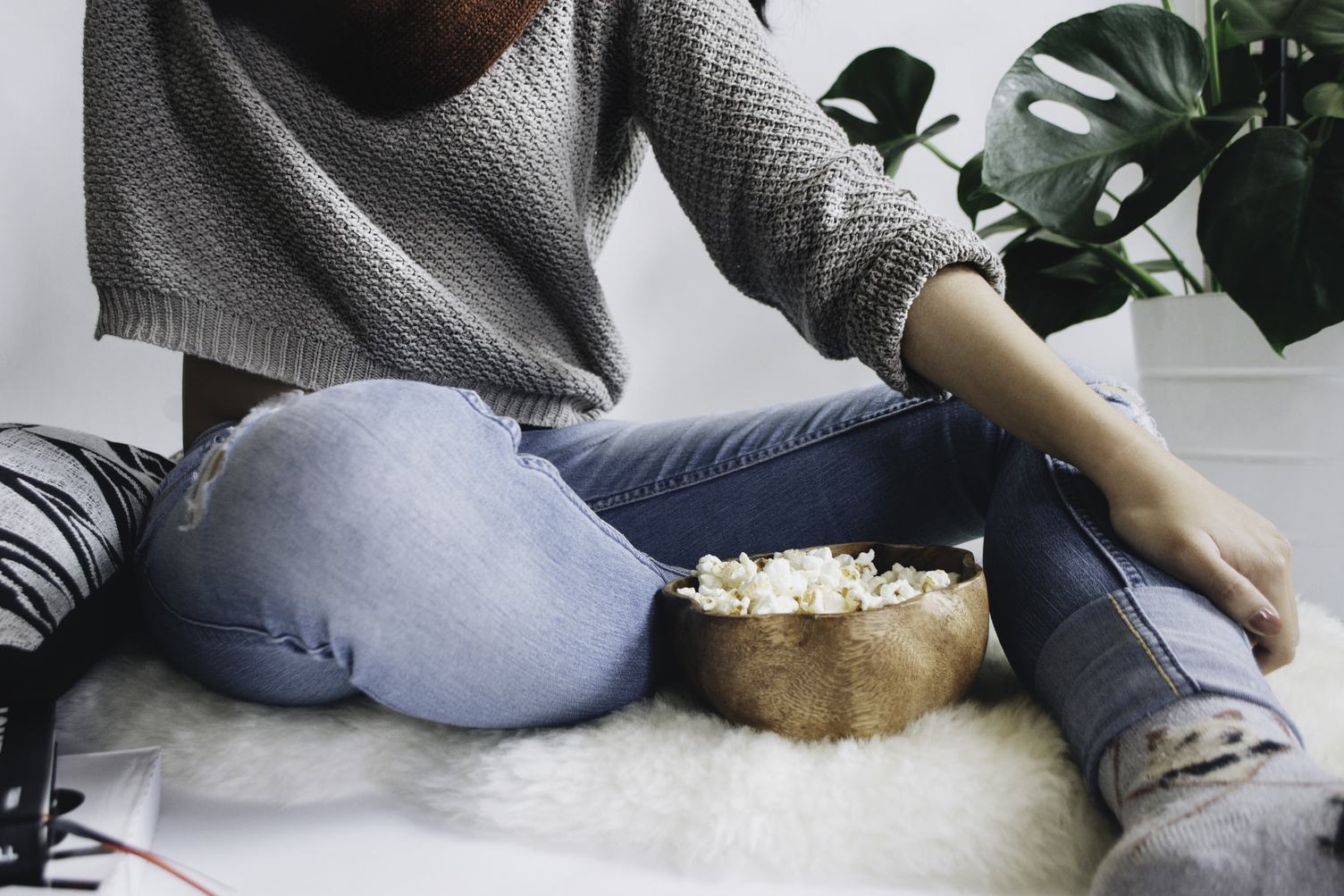 Woman with a Large Wooden Bowl of Popcorn