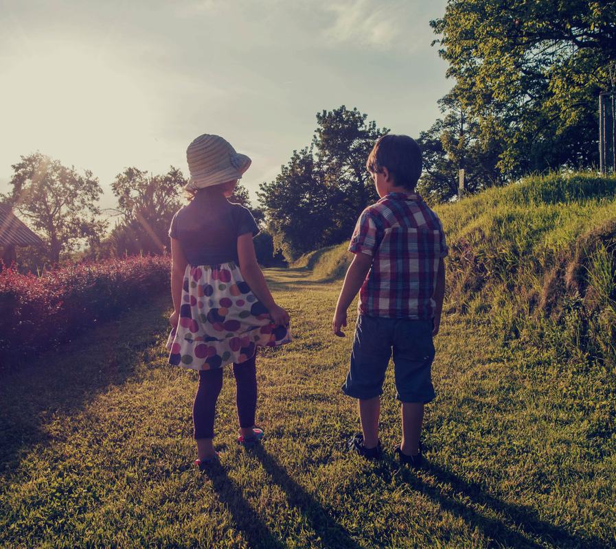 Free Photo: Brother and Sister Walking in the Garden