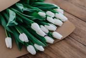 White Tulips on Wooden Table