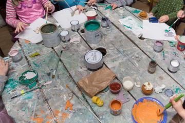 Children are Painting at the Table