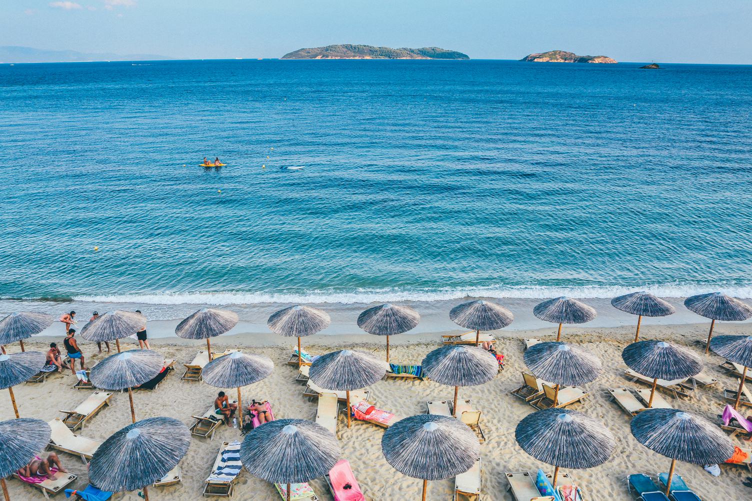 Beach Scene with Beautiful Turquoise Sea and Umbrellas