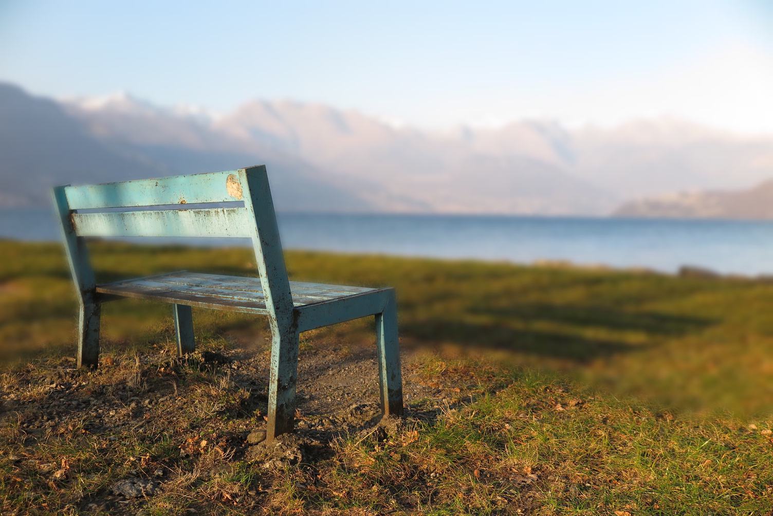 Bench by the Lake in the Mountains