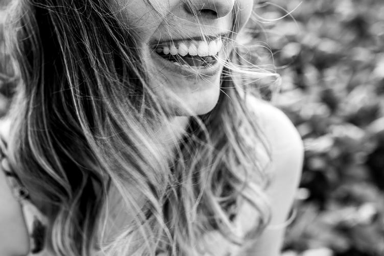 Outdoor Portrait of a Beautiful Happy Smiling Young Woman