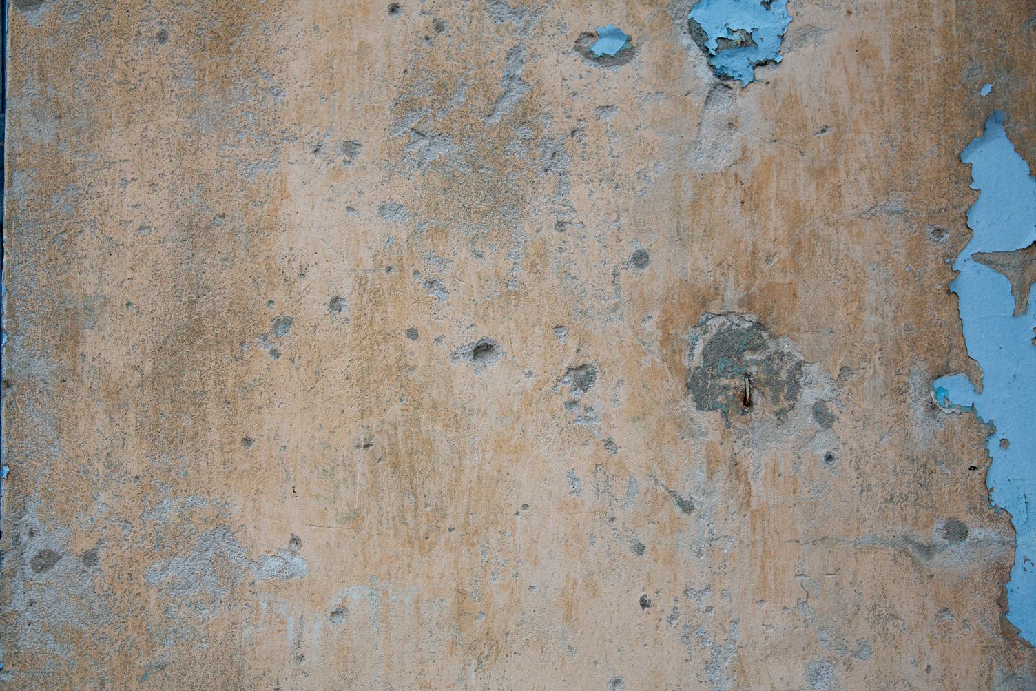 Grunge Wall with Remnants of Blue Paint