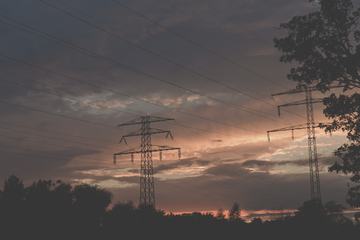 Sunset over High Voltage Pylons